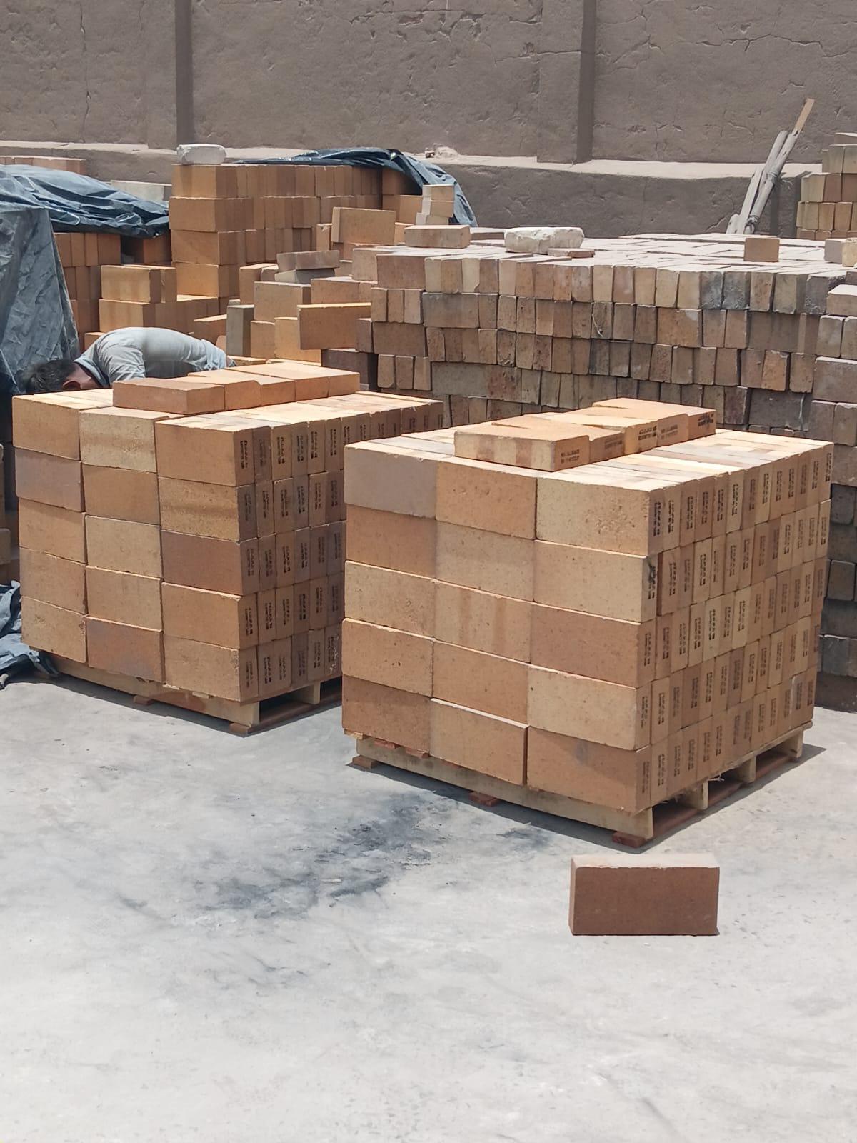 Sillimanite tapered refractory bricks stacked on pallets for dispatch